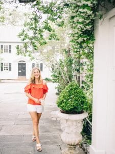 girl in red top downtown charleston