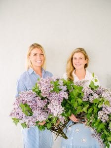 girls holding lilac